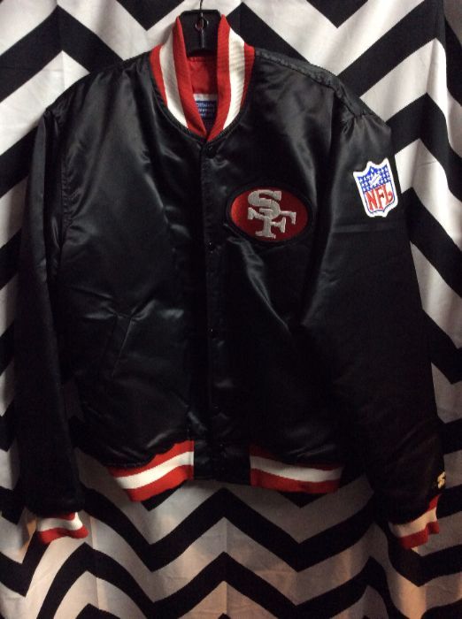 Black 49ers Starters jacket with ornate letters on back 1