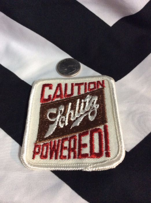 product details: CAUTION SCHLITZ POWERED! PATCH - OLD STOCK photo