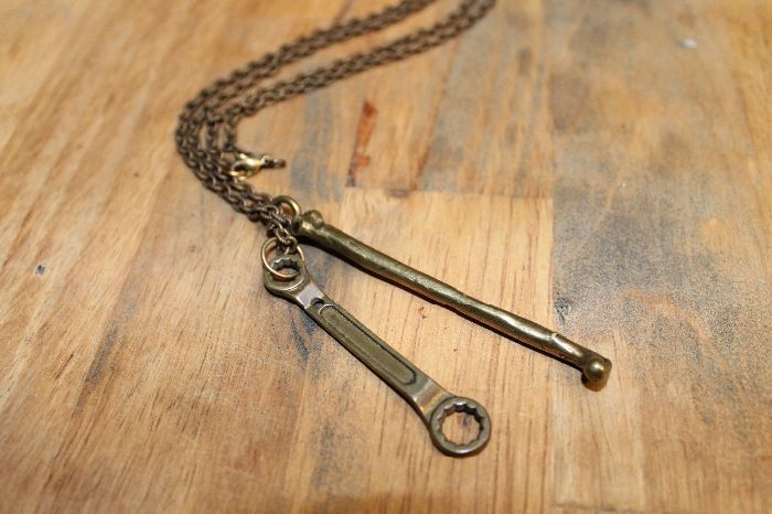 product details: NECKLACE - DOUBLE CHARM - FEMUR BONE & WRENCH - LONG LINK CHAIN photo