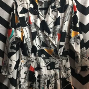 Photo detail:GEOMETRIC ABSTRACT DESIGN JUMPSUIT W/ SHOULDER PADS