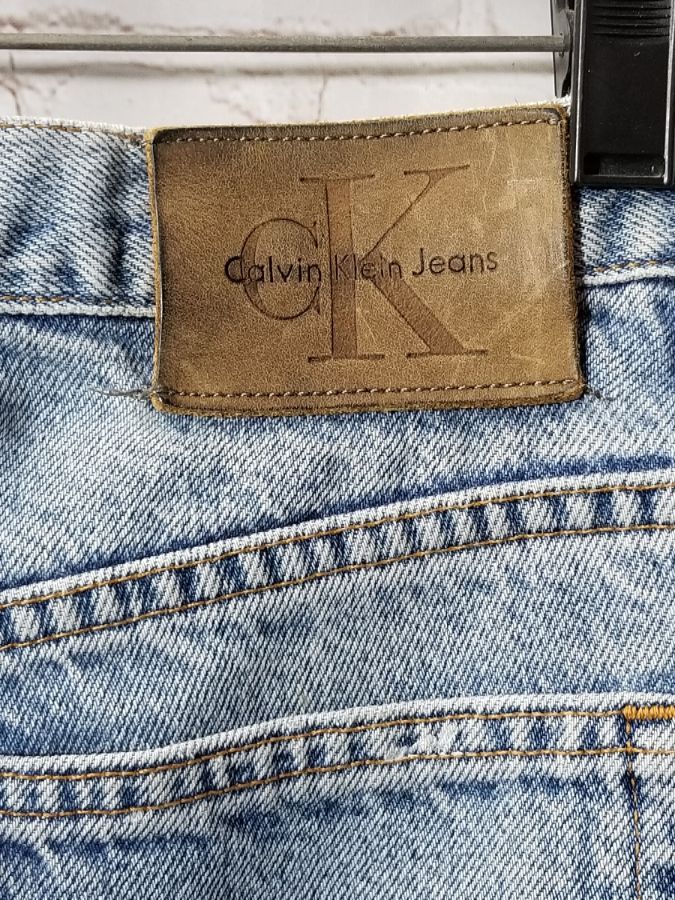 Calvin Klein Paint-splattered Tattered-ankles Denim Jeans | Boardwalk ...