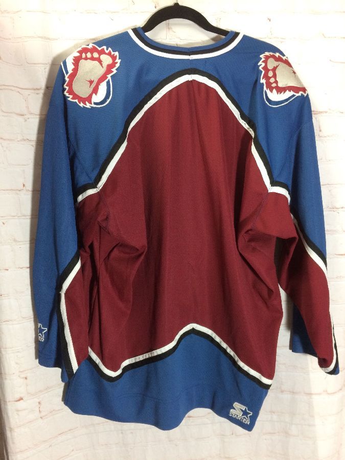 foot on colorado avalanche jersey