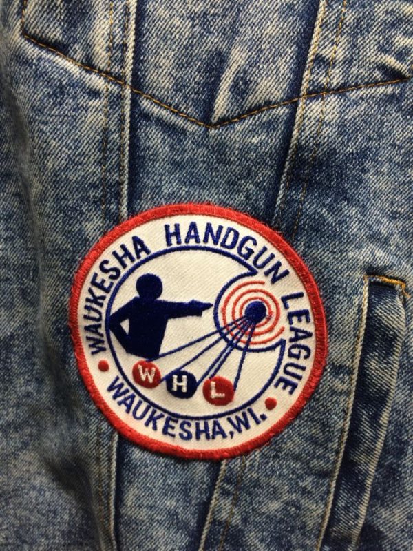 DENIM JACKET W/ PATCHES DOTTIE/WAUKESHA HANDGUN/FLETCHER ARMS INC