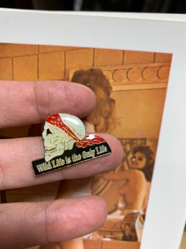 product details: WILD LIFE IS THE ONLY LIFE SKULL ENAMEL PIN photo