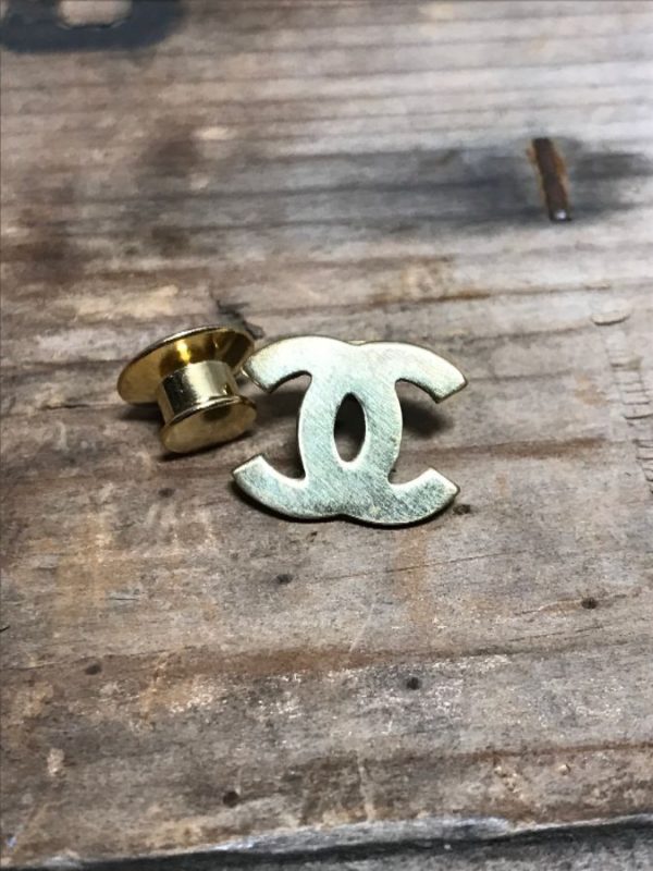 product details: SOLID BRASS CHANEL LOGO PIN photo