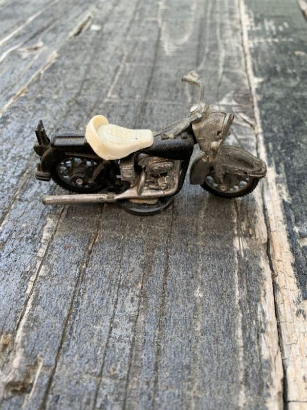 product details: VINTAGE TOY MOTORCYCLE MOVING WHEEL & AXLE MAGNETIC BOTTOM PIECE photo