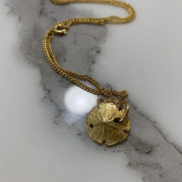 product details: GOLD PLATED SAND DOLLAR NECKLACE photo