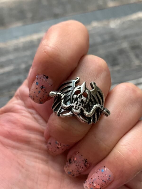 product details: ZOMBIE CYCLE WINGED SKULL WITH MOTORCYCLE BARS SILVER BIKER RING photo