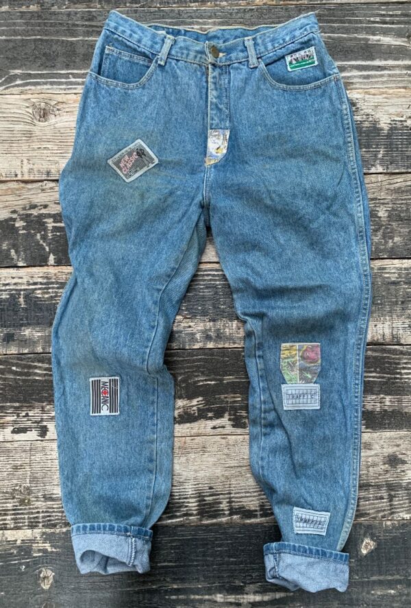 product details: RAD 1980S DENIM COMIC BOOK PATCHED ZIPPER FLY HIGH WAISTED DENIM JEANS AS-IS photo