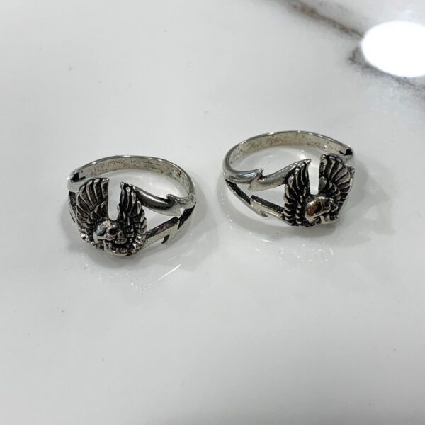 product details: SCREAMING WINGED SKULL PROFILE LIGHTNING BOLT SIDED SILVER RING photo
