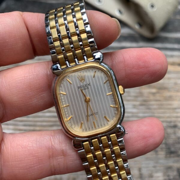 product details: VINTAGE ROLEX GENEVE WOMENS GOLD AND SILVER TONE RECTANGULAR ANALOG STAINLESS STEEL WATCH photo