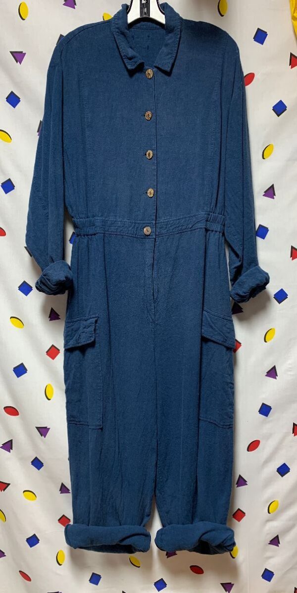 product details: FLOWY LONG SLEEVE BUTTON DOWN  COLLARED JUMPSUIT WITH STRETCH WAIST AND CARGO POCKETS photo