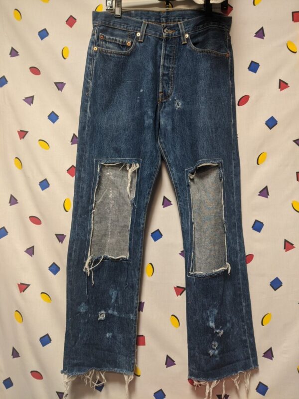 product details: LEVIS 501 RED TAG DISTRESSED DENIM JEANS WITH LARGE CUT OUT FRONT AND PVC ADD-ON photo