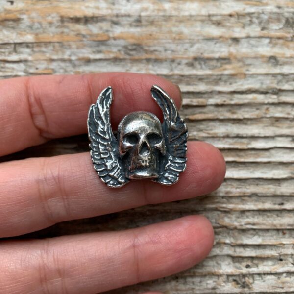 product details: DEADSTOCK SKULL AND WINGS HEAVY METAL BIKER PIN photo