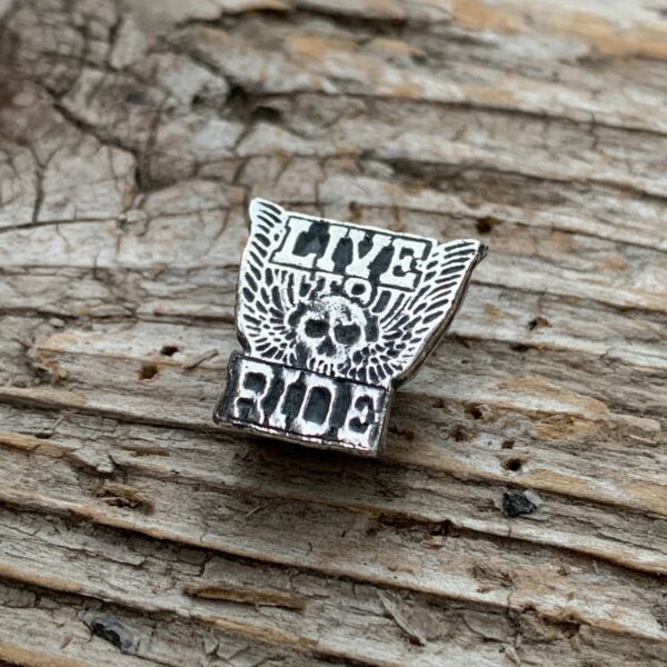product details: VINTAGE DEADSTOCK LIVE TO RIDE SKULL & WINGS HEAVY METAL BIKER PIN photo