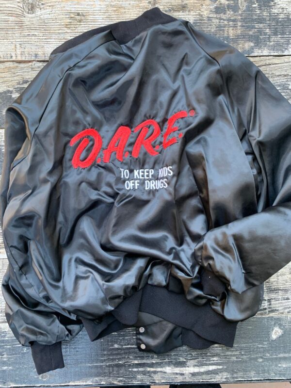 product details: DARE TO KEEP KIDS OFF DRUGS SATIN BOMBER BUTTON UP JACKET EMBROIDERED VARSITY STYLE LETTERING ON BACK photo