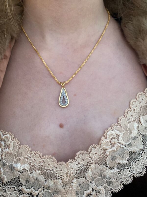 product details: RHINESTONE TEARDROP GOLD AND SILVER PENDANT NECKLACE photo