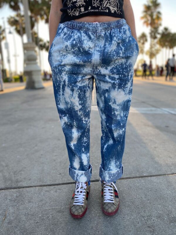 product details: RAD SPLATTER BLEACH-DYED DENIM PANTS WITH FRONT POCKETS AND DRAWSTRING WAIST photo
