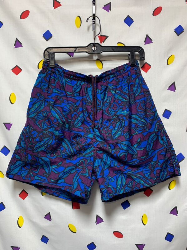 product details: RETRO 90S DARK BLUE FLORAL PRINT NYLON DRAWSTRING WAIST ELASTIC SHORT LENGTH SWIM TRUNKS photo