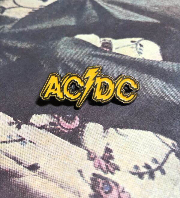 product details: NEW PIN - ACDC SHOCK LOGO SYMBOL YELLOW photo