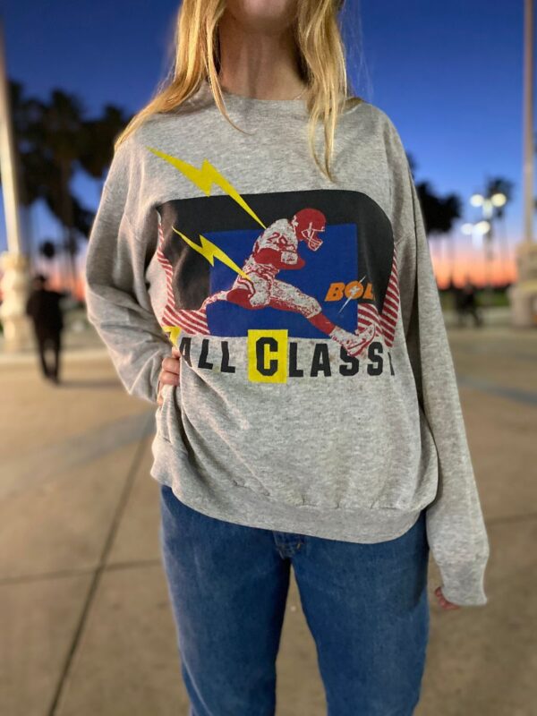 product details: RARE BOLT FALL CLASSIC FOOTBALL PLAYER CREWNECK PULLOVER SWEATSHIRT WITH COLOR BLOCK LIGHTNING BOLT GRAPHIC DESIGN AS-IS MADE IN USA photo