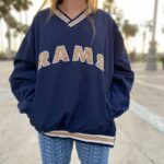 NFL RAMS WINDBREAKER PULLOVER SWEATSHIRT WITH FRONT POCKETS AND BOTTOM SIDE ZIP
