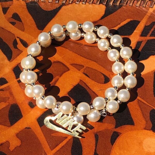 product details: MEMORY WIRE WRAP AROUND PEARL BRACELET WITH NIKE CHARM photo