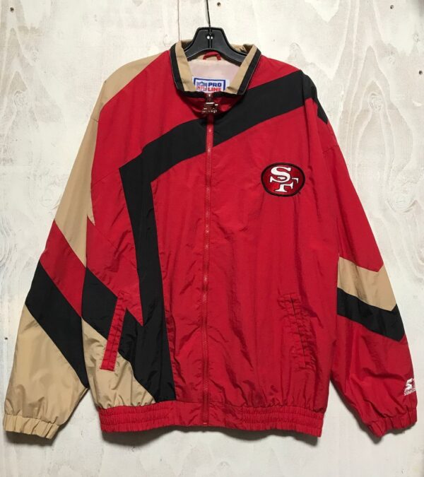 product details: SAN FRANCISCO 49ERS FRONT LOGO BACK LETTERING NFL FOOTBALL WINDBREAKER JACKET WITH ZIP FRONT DUAL POCKETS NYLON LINING photo