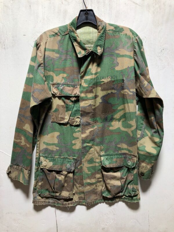 product details: LIGHT WEIGHT DISTRESSED CAMOUFLAGE MILITARY JACKET THREE FRONT POCKETS NAME A CALLAHAGN photo