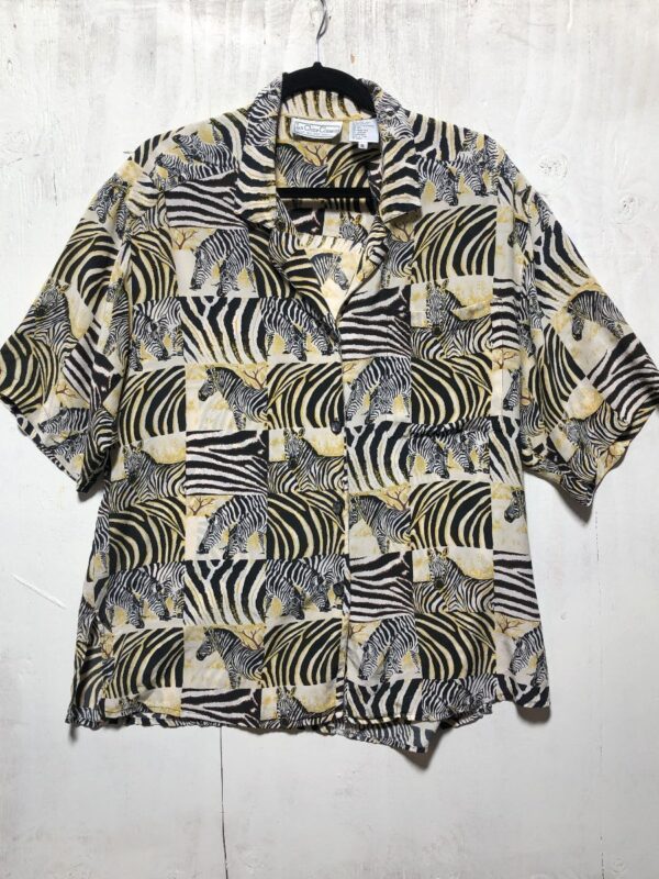 product details: ALL OVER ZEBRA PRINT SS BD 100% SILK BUTTON UP BLOUSE WITH FRONT POCKET BOXY FIT photo