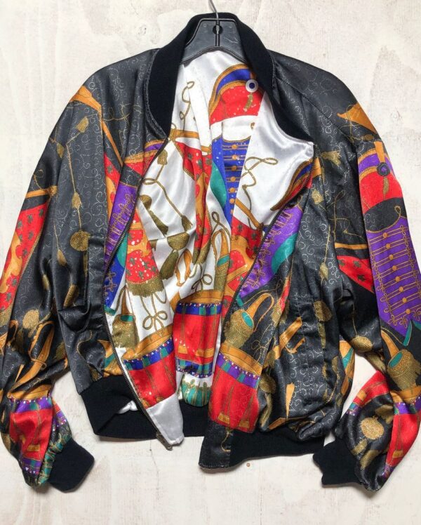 product details: SILKY ORNATE TRUMPETS AND DRUMS REVERSIBLE BOMBER JACKET photo
