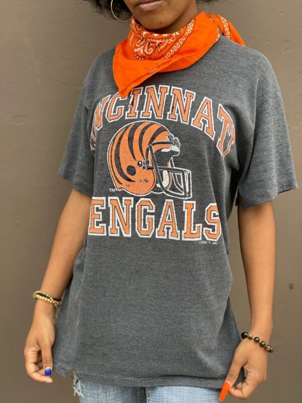 product details: DISTRESSED CINCINNATI BENGALS FOOTBALL HELMET GRAPHIC T-SHIRT photo