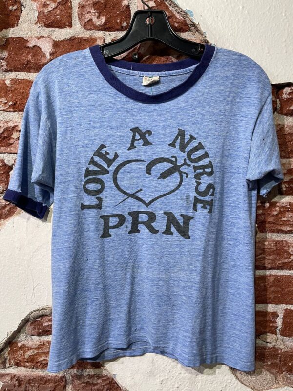 product details: AS IS - SUPER THIN SINGLE STITCH LOVE A NURSE PRN HEART W/ NEEDLE GRAPHIC T-SHIRT photo