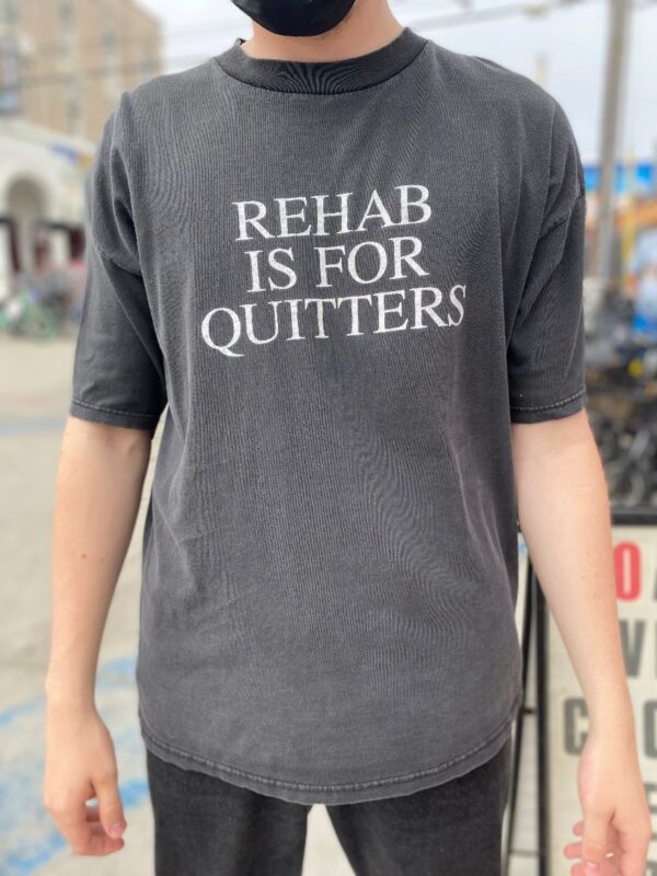 product details: RAD REHAB IS FOR QUITTERS GRAPHIC T-SHIRT photo