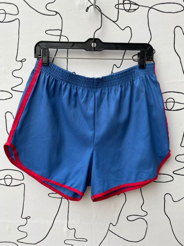 product details: 1970S ATHLETIC RUNNING SHORTS WITH ELASTIC WAIST AND RED TRIM photo