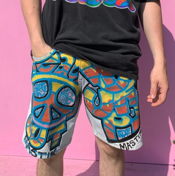 product details: 1990S ONE OF A KIND, HAND PAINTED ARTIST PEACE OUT WORD UP ABSTRACT MASTIK DENIM SHORTS photo