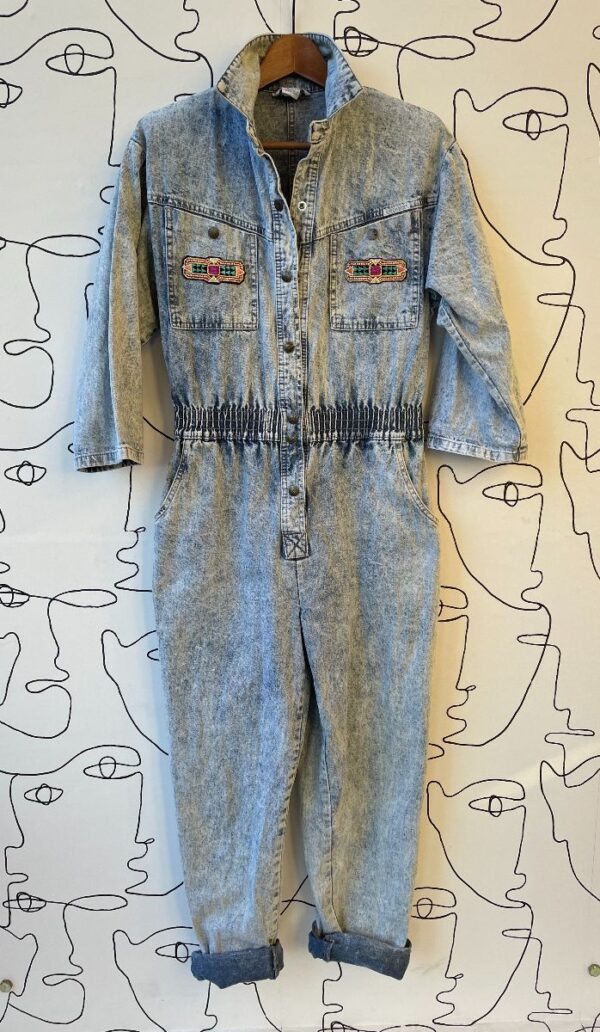 product details: COOL DENIM COLLARED LONG SLEEVE ACID WASH JUMPSUIT WITH FRONT POCKET GEOMETRIC PATCHES photo