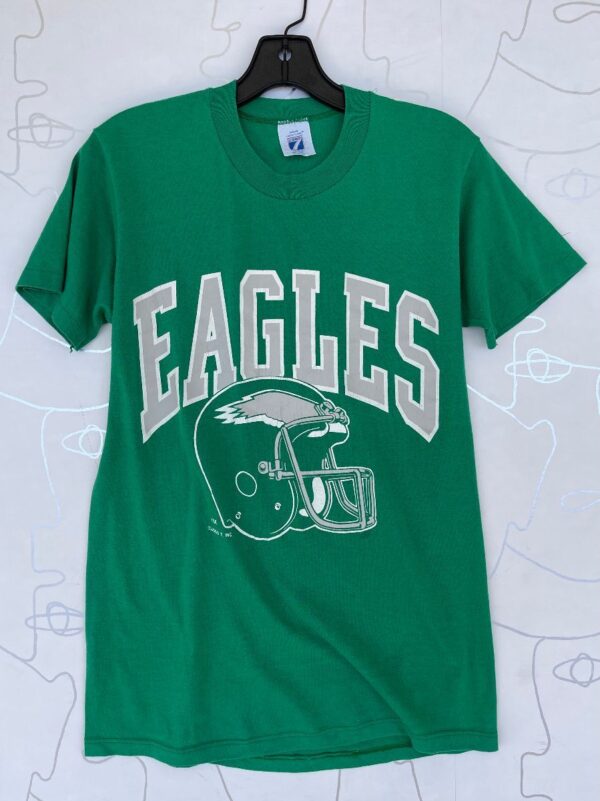 product details: EAGLES FOOTBALL HELMET GRAPHIC T-SHIRT photo