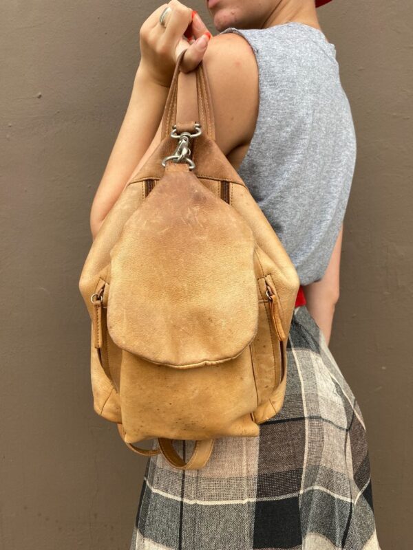 product details: AS-IS DISTRESSED LEATHER BACKPACK PURSE WITH MULTI ZIP POCKETS AND FRONT HOOK CLASP photo