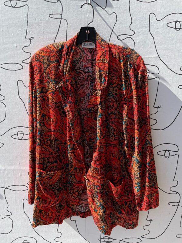 product details: RED ORGANIC ALL OVER PRINT BLAZER STYLE TOP WITH SHOULDER PADS photo