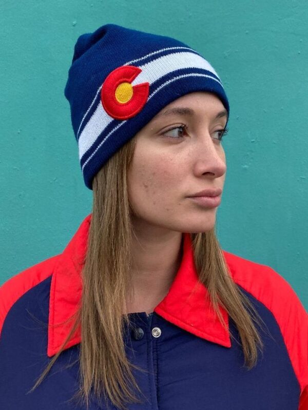 product details: KNIT BEANIE WITH HORIZONTAL BOTTOM STRIPE AND LARGE EMBROIDERED COLORADO EMBLEM photo