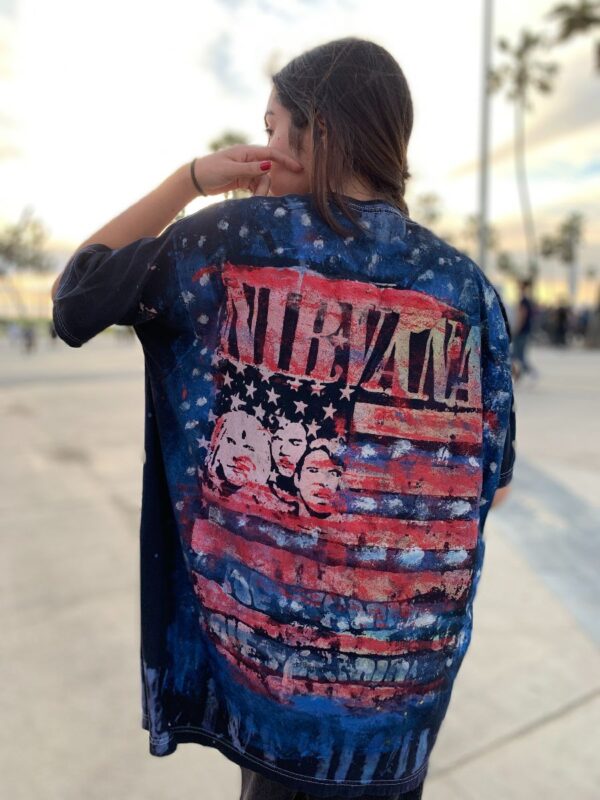 product details: NIRVANA SMILE AND AMERICAN FLAG HAND-PAINTED ON BLEACHED OUT T-SHIRT photo