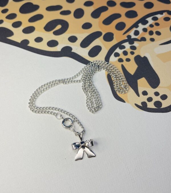product details: SILVER BOW CHARM NECKLACE THIN CHAIN *DEADSTOCK photo