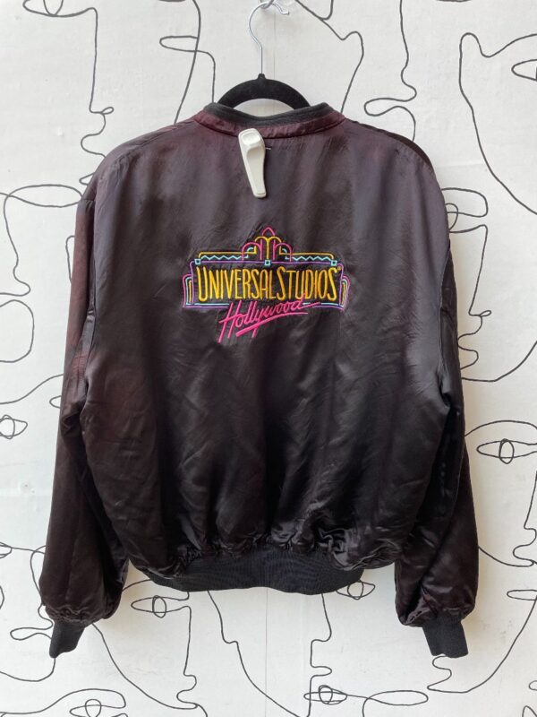 product details: AS-IS UNIVERSAL STUDIOS HOLLYWOOD EMBROIDERED LOGO ACETATE JACKET photo