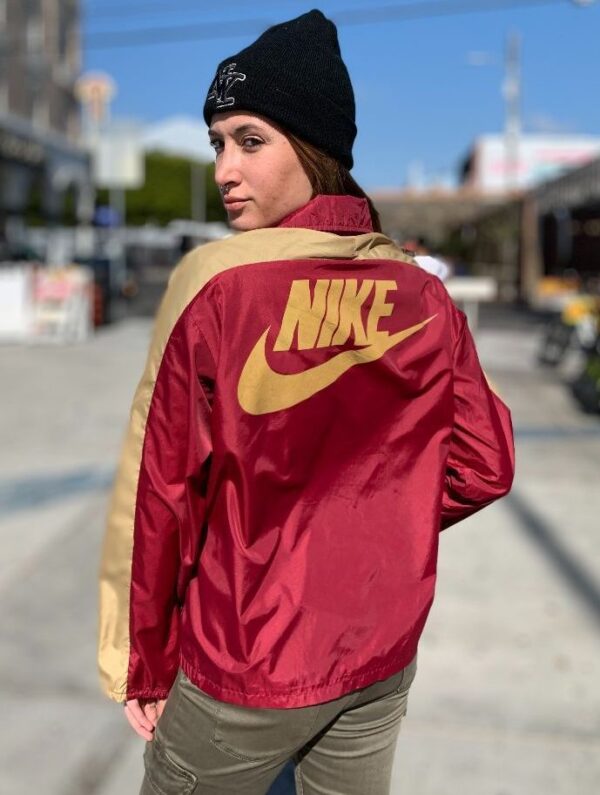 product details: RETRO NIKE QUARTER ZIP WINDBREAKER W/ FRONT ZIPUP POUCH AND LARGE NIKE LOGO ON BACK WHITE TAG photo