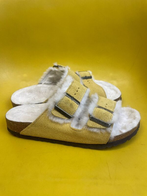 product details: BIRKENSTOCK ARIZONA SHEARLING OCHRE SUEDE DOUBLE BUCKLE SANDAL WITH FUZZY FAUX FUR LINING photo