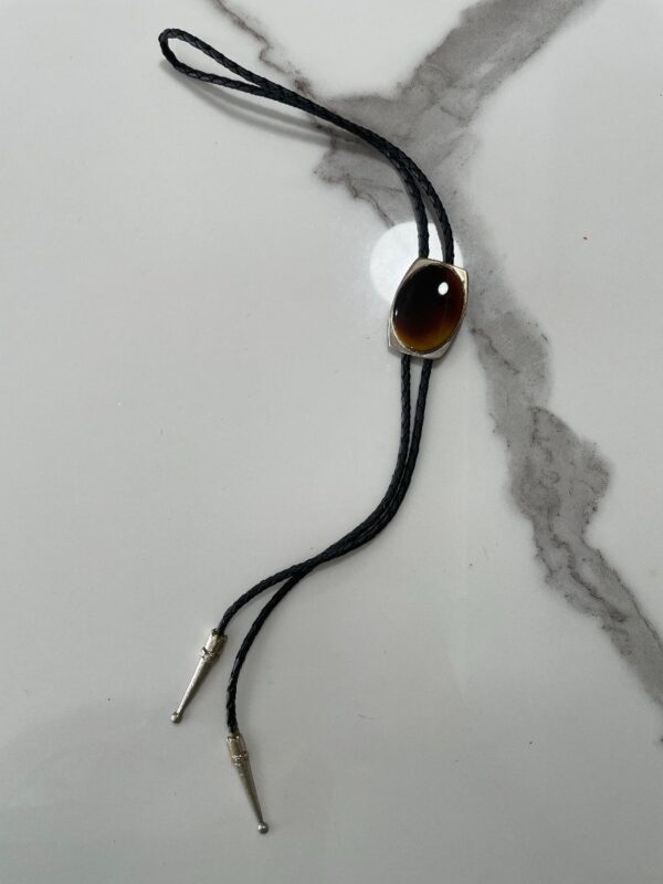 product details: TIGERS EYE ENCASED POLISHED STONE BOLO TIE BRAIDED LEATHER CORD photo