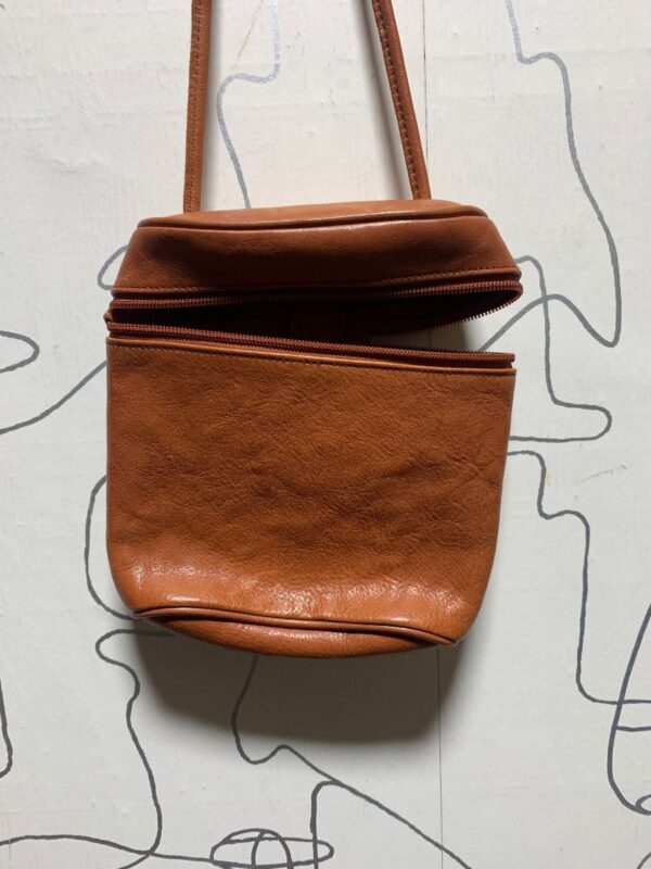 product details: MINI LEATHER TRAVEL PURSE W/ THIN LEATHER STRAP photo