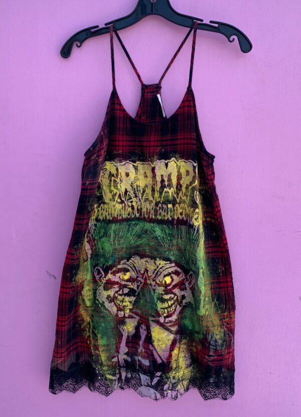 product details: THE CRAMPS BAD MUSIC FOR BAD PEOPLE FRONT GRAPHIC AND PSYCHOBILLY BACK GRAPHIC HAND PAINTED ON PLAID RACER STRAP LACE BOTTOM DRESS photo