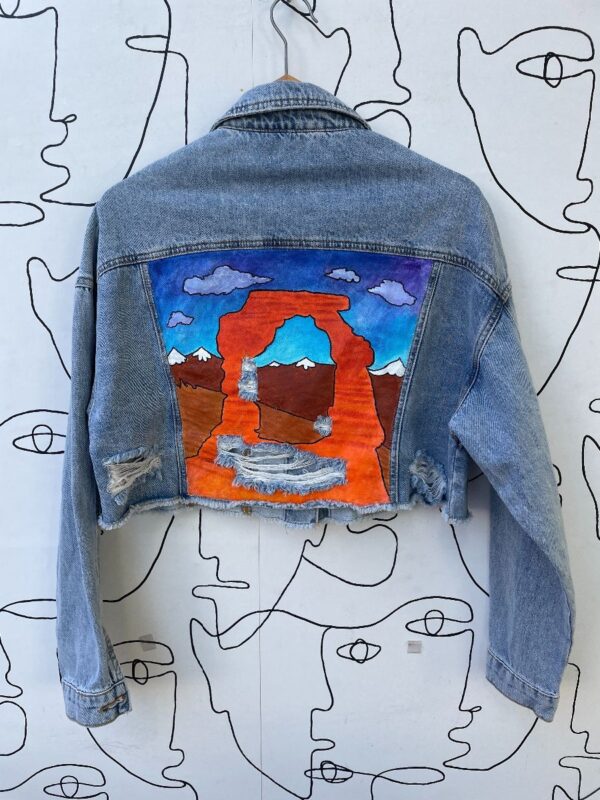 product details: HAND PAINTED UTAH ROCK ARCH DISTRESSED CROPPED DENIM JACKET photo